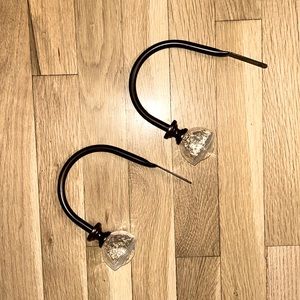 2 oil rubbed bronze u shaped curtain tie backs. Blown bubble glass ends.